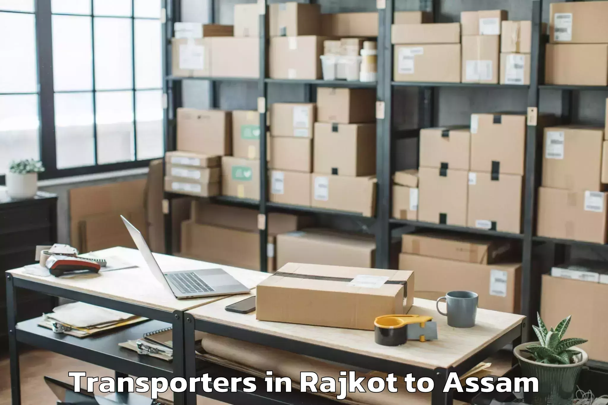 Book Rajkot to Behali Transporters Online